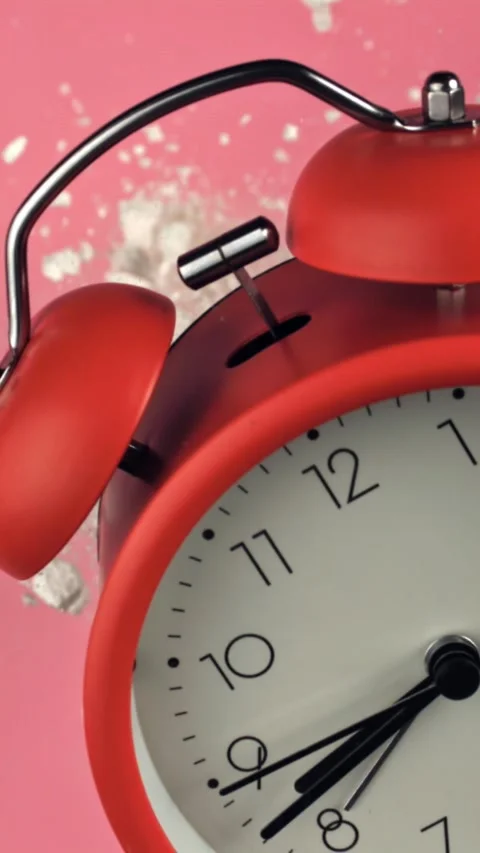 Alarm clock and school crayons fly up on a black background. Filmed on a high Stock Footage 335380659