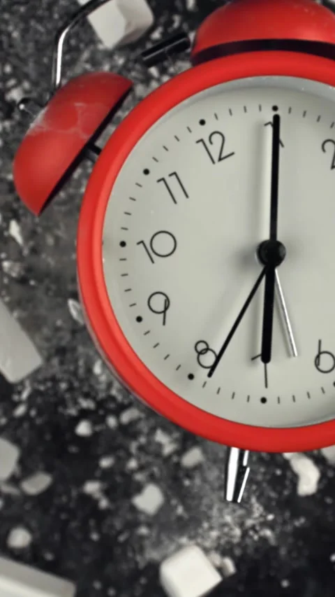 Alarm clock and school crayons fly up on a black background. Filmed on a high Stock Footage 335385174