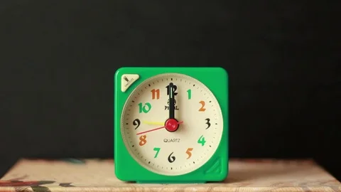 Alarm clock arrows close to twelve 스톡 동영상 76039583