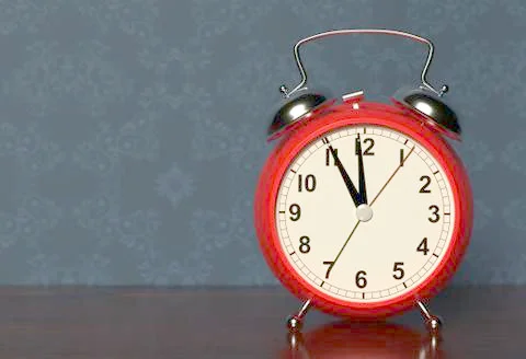 Alarm clock on bedside table. 3D rendering Stock Illustration