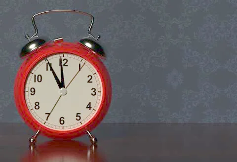 Alarm clock on bedside table. 3D rendering Illustrazione stock