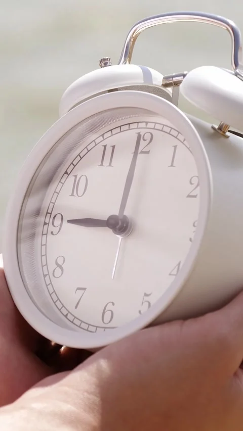 Alarm clock beside sea marks beginning of summer vacation and exciting travel Stock Footage 341866941