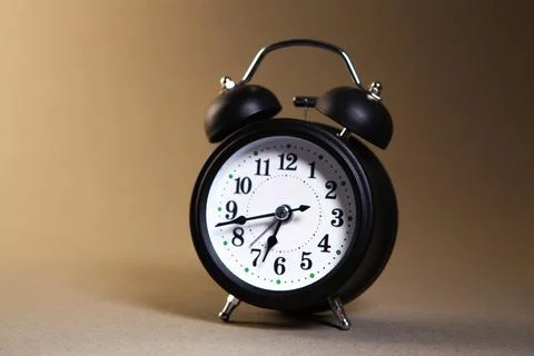 Alarm clock on a black background Stock Photos