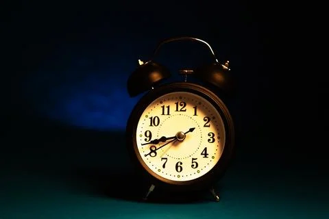 Alarm clock on a black background 写真素材