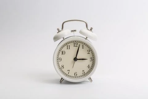 Alarm clock on blue background Stock Photos