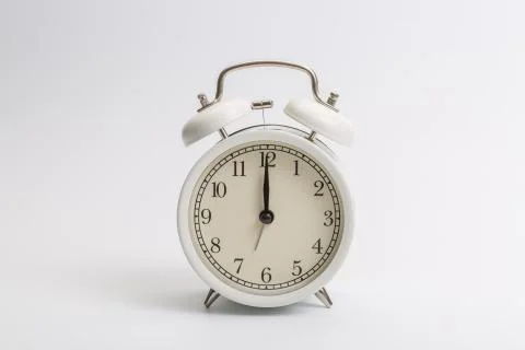 Alarm clock on blue background Stock Photos