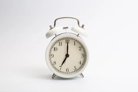 Alarm clock on blue background Stock Photos