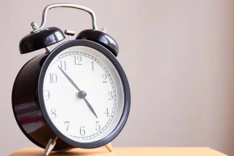 Alarm clock on the book Foto stock