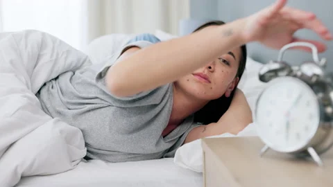 Alarm clock click, sleeping and couple in bed hit snooze to rest, relax and Stock Footage 225348493