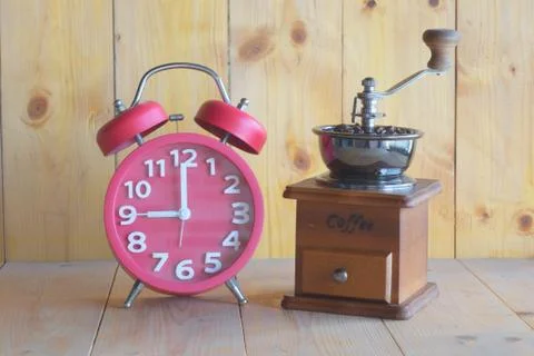 Alarm clock, coffee grinder Stock Photos