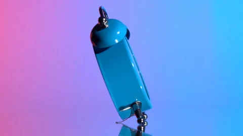 Alarm clock on a colored background Видео 120542875