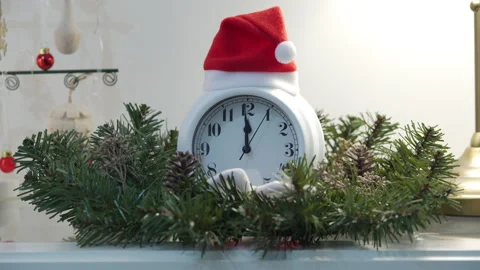 Alarm clock counting down to midnight for New Year. Metal Christmas tree between Stock Footage 165414305