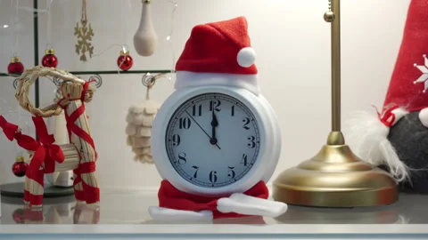 Alarm clock counting down to midnight for New Year. Metal Christmas tree between Stock Footage 165770113