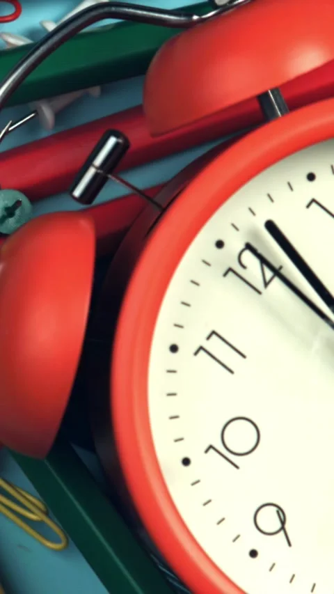The alarm clock falls on school tools. Filmed on a high-speed camera at 1000 fps Stock Footage 335372625