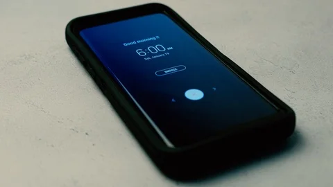 Alarm clock going off on smartphone Stock-Footage 103539506