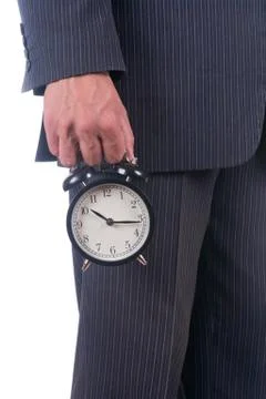 Alarm clock in a hand Stock Photos