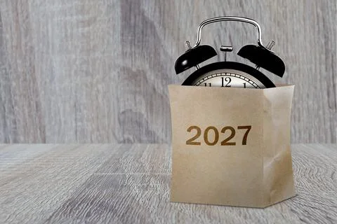 Alarm clock inside paper bag Фото