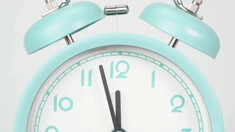 Alarm clock isolated Twelve o'clock Time lapse 30 minutes on white background. Stock Footage 146761493