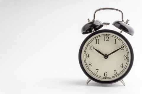 Alarm Clock isolated on white background with selective focus and crop fragme Stock Photos
