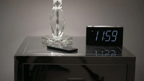 Alarm Clock On Night Table Stock Footage 246256685