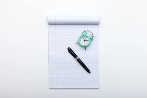 Alarm clock, notes and pen Stock Photos