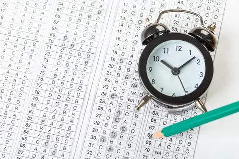 Alarm clock, optical form of standardized school test with bubble and black p Stock Photos