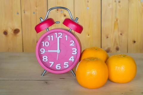 Alarm clock, orange Stock Photos