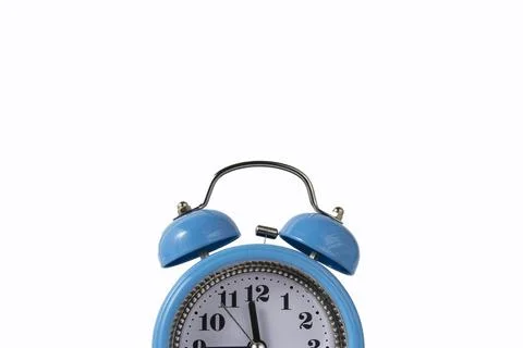 Alarm clock over white. Time concept. Blue alarm clock morning time. Stock Photos