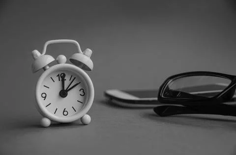 Alarm clock pointing at 2 o'clock with black and white background Stock Photos