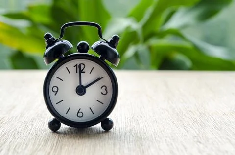 Alarm clock pointing at 2 pm with customizable background space for text or.. Stock Photos