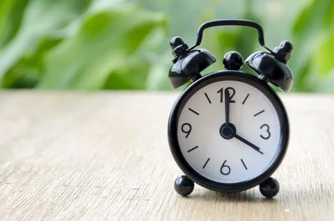 Alarm clock pointing at 4 pm with customizable background space for text or.. Stock Photos