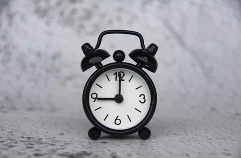 Alarm clock pointing at 9 o'clock with customizable space for ideas or text. Stock Photos
