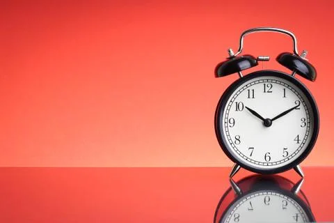 Alarm Clock on red background with selective focus Stock-Fotos