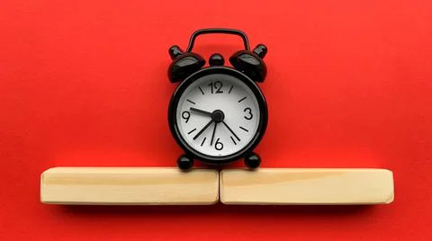 Alarm clock on red background. Time concept Stock Photos