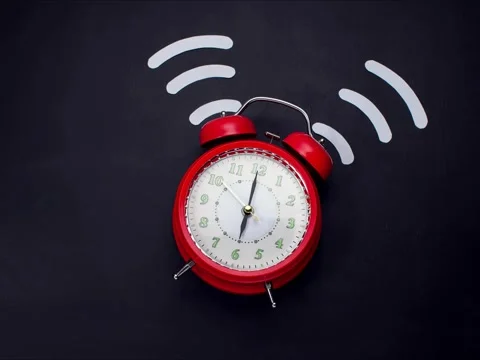 Alarm clock ringing on the dark surface. Morning and time management concept Stock Footage 140617629