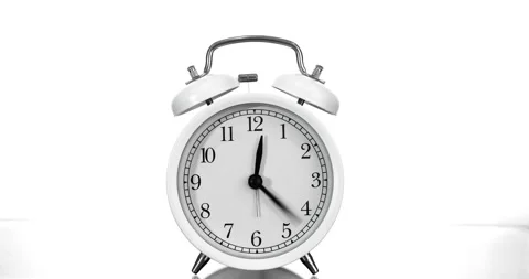 Alarm clock running time lapse on white background Stock Footage 338314710