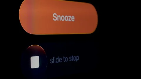 Alarm clock on screen smart phone, Snooze and stop button Stock Footage 321947661