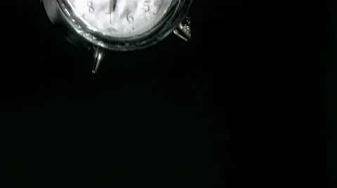 Alarm clock in a super slow motion falling in water Stock-Footage 10866392
