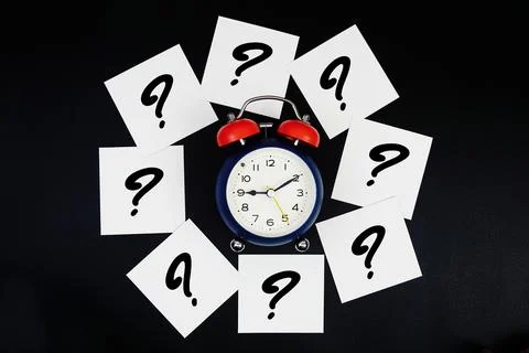 Alarm Clock Surrounded with Question Mark Stock Photos