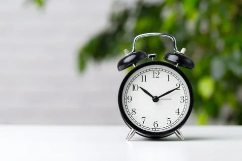 Alarm clock on table Stock Photos