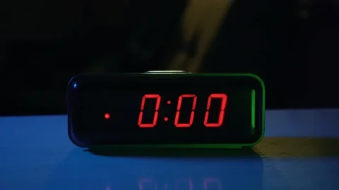 Alarm clock on the table rings at 0 o'clock Video stock 200880324