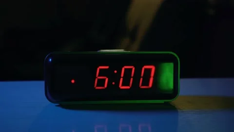 Alarm clock on the table rings at 6 o'clock in the morning Stock Footage 201215016