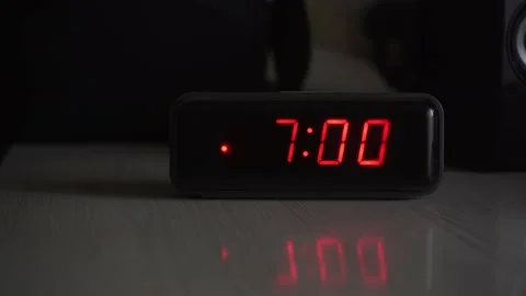 The alarm clock on the table rings at 7 o'clock in the morning Stock Footage 164036430