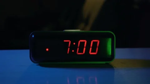 Alarm clock on the table rings at 7 o'clock in the morning Stock Footage 201306915