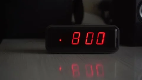 The alarm clock on the table rings at 8 o'clock in the morning Stock Footage 164036428