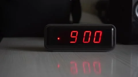 The alarm clock on the table rings at 9 o'clock in the morning Stock Footage 164036402