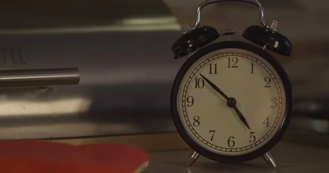 The alarm clock on the table rings Stock Footage 122272050