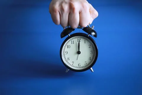 Alarm clock on the table. Time concept. Being late for work and school. Stock Photos