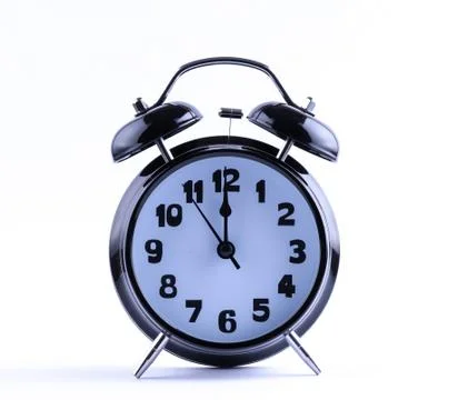 Alarm clock  with twelve o'clock Stock Photos