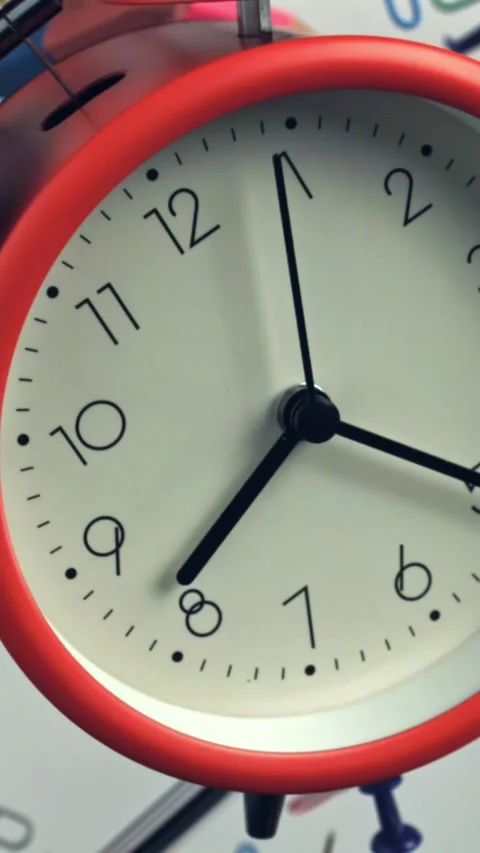 An alarm clock with various school supplies flies up and falls. Filmed on a high Stock Footage 335377736